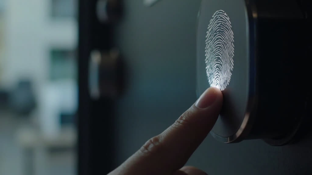 Close-up of fingerprint scanner on a modern smart lock